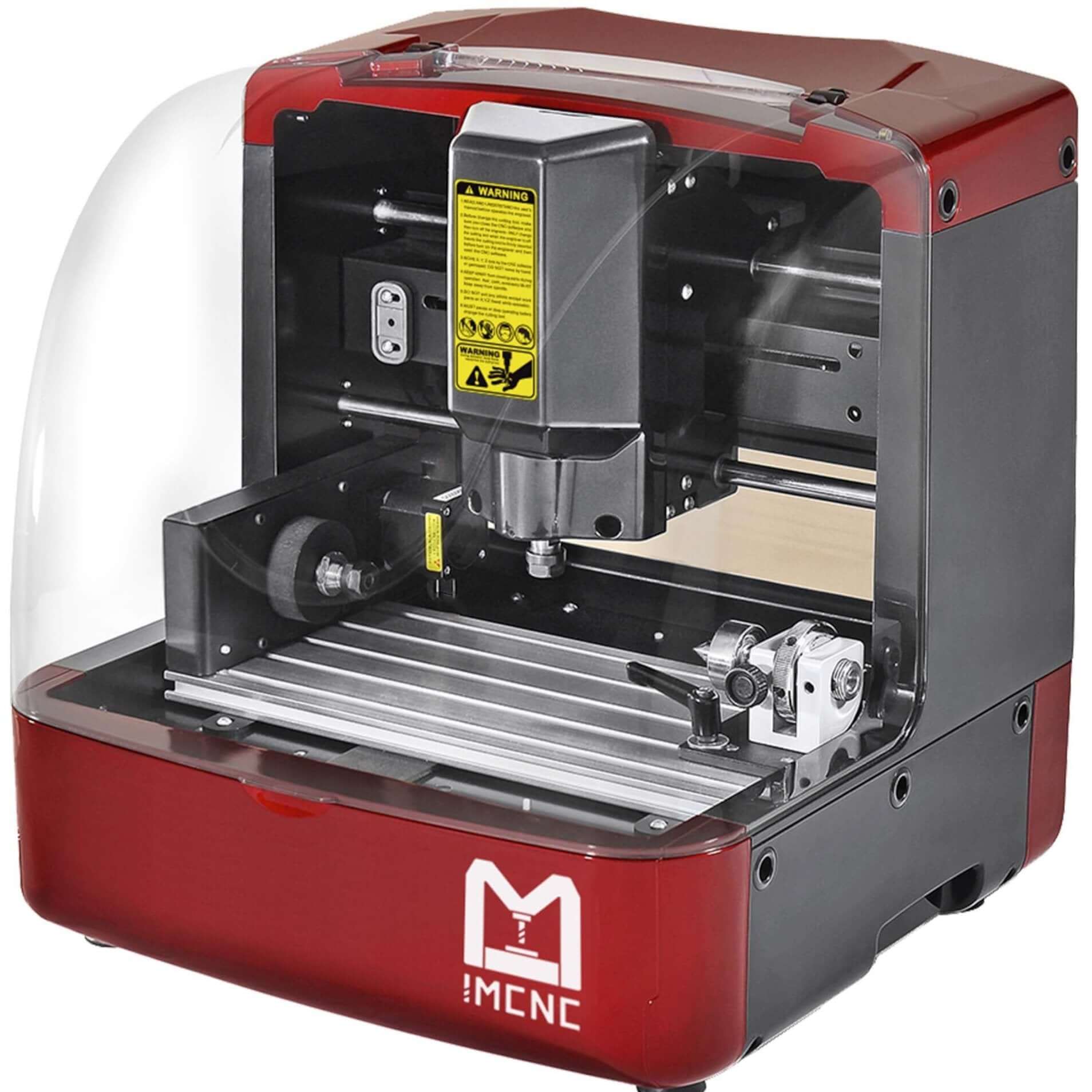 Product studio shot of IMCNC mini CNC engraving machine with rotary axis attachment, red housing, clear safety cover, and yellow warning label on spindle.
