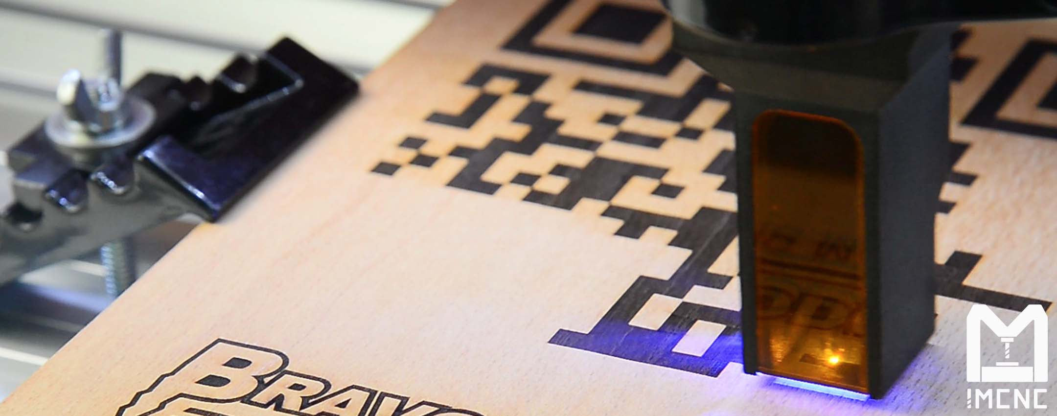 Close-up of laser engraving QR code with IMCNC CNC machine.