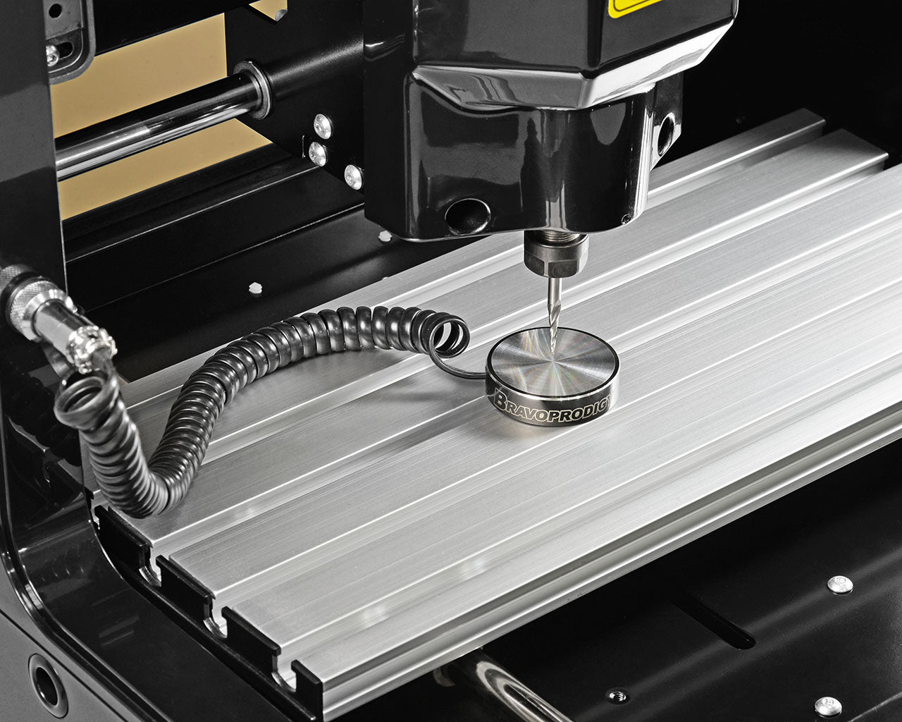 Close-up of IMCNC touch plate tool-setter with magnetic base mounted on desktop mini CNC machine.