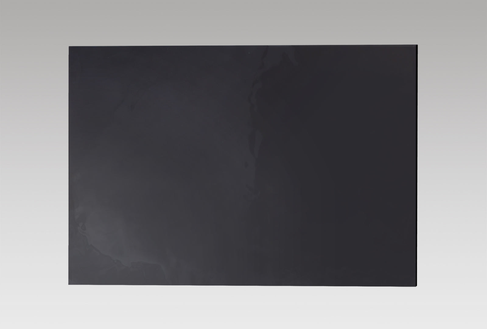 Silicone pad for securing acrylic sheets during CNC engraving to prevent shifting and ensure stable cutting.