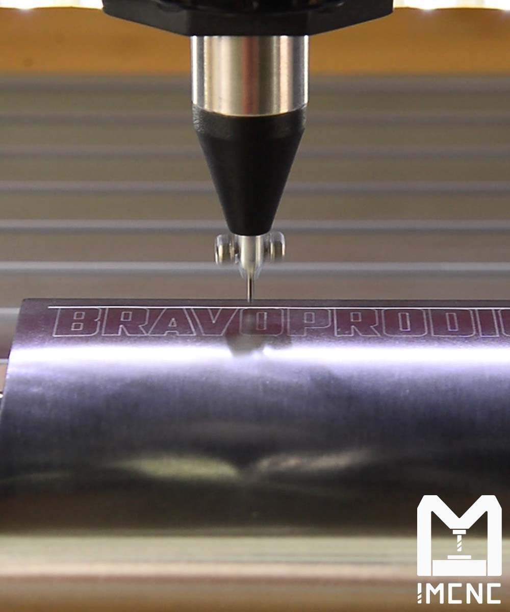 Precision dot peen engraving of BRAVOPRODIGY logo on aluminum bottle.