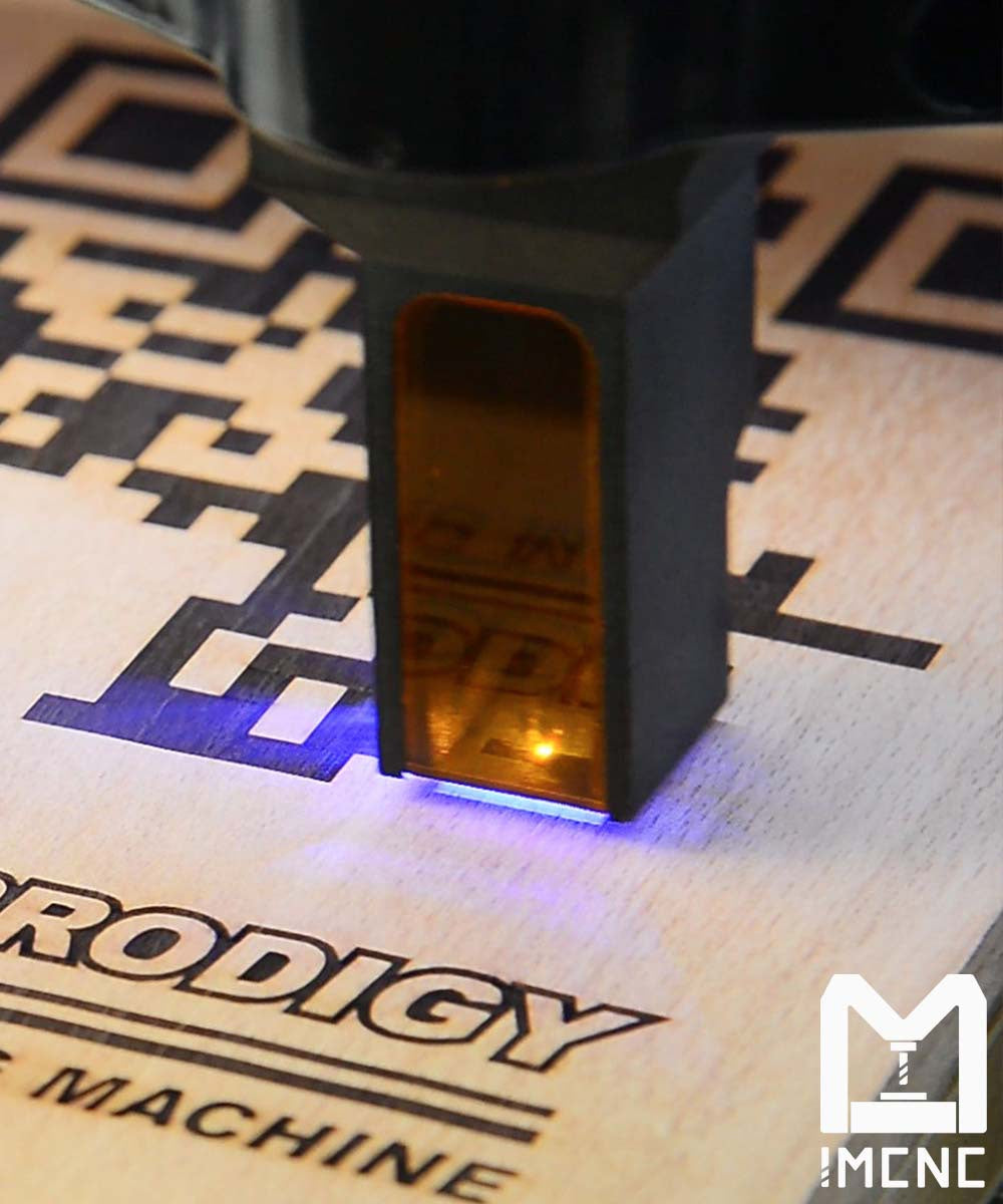 CNC mini laser engraver carving logo and QR- Code on wood with protective shield and LED lighting for precision and safety.