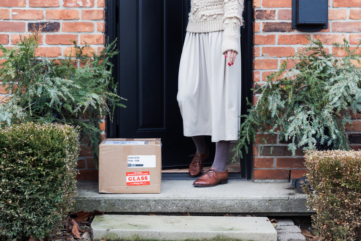 Package outside the door, showing product will be sent safely and fast, for webpage decoration.